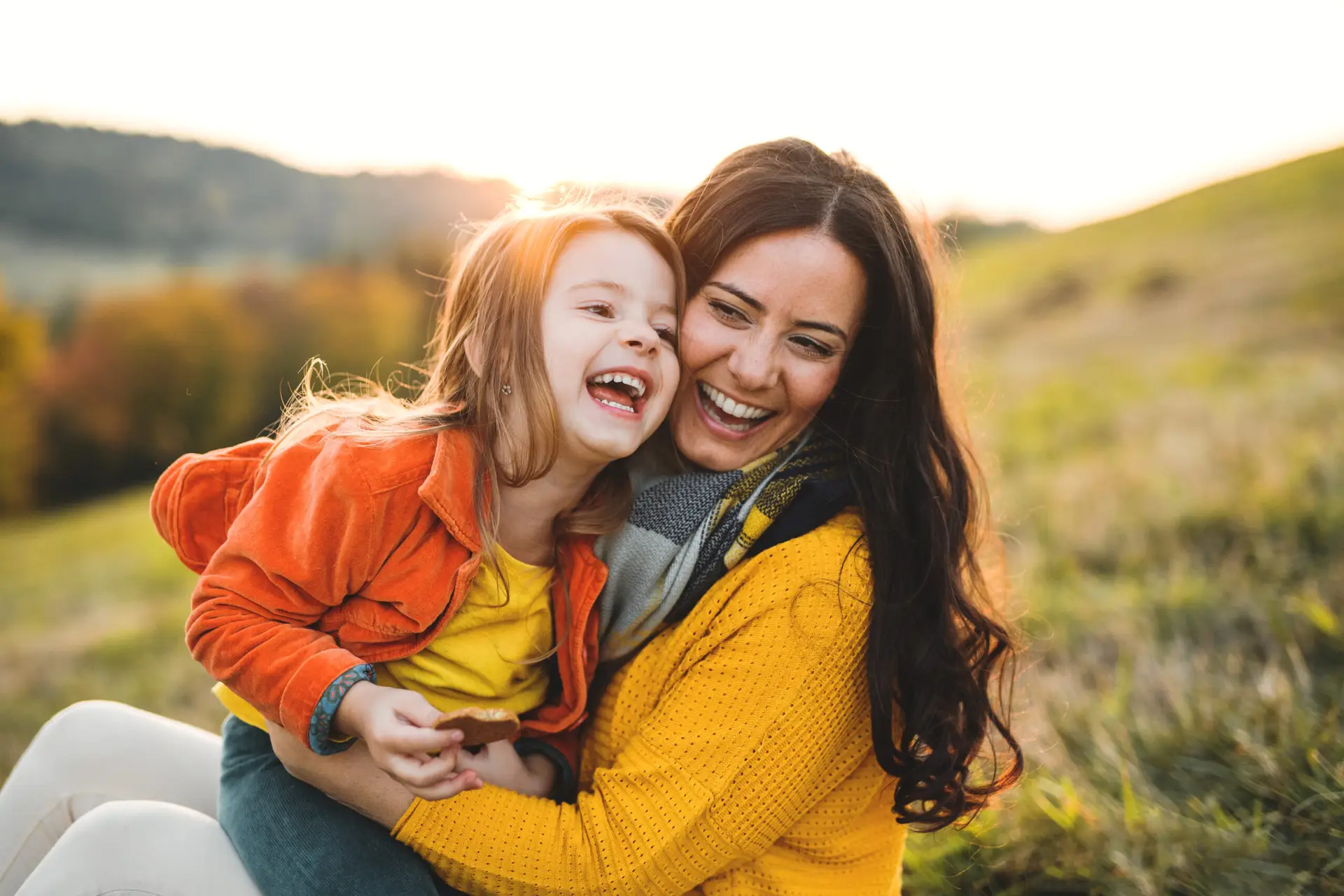 mom and daughter hugging