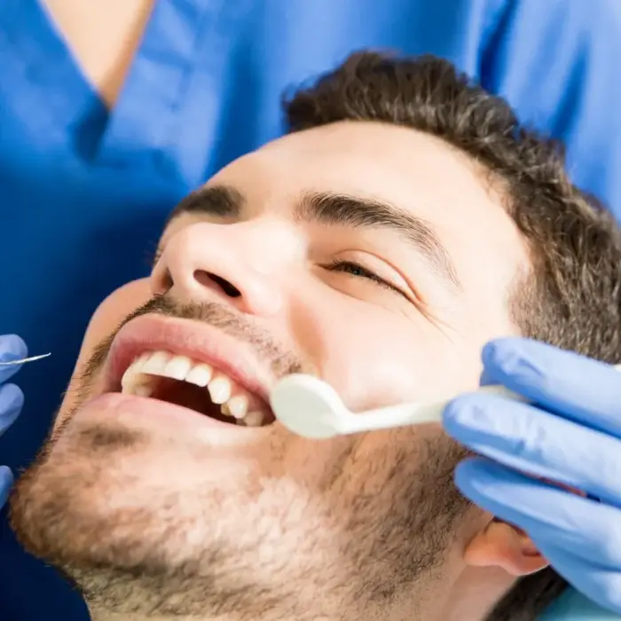 adult patient receiving dental treatment